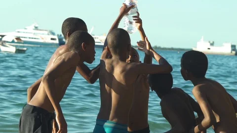 Group of children caught fish in bottle Video stock 85789927