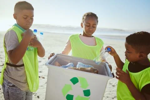 Group of children cleaning beach or recycling plastic for education, learning or Stock Photos