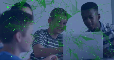 Group of children collaborating around laptop in classroom, with floating tech Stock Footage 309285649