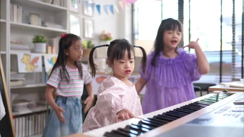 A group children doing activities singing and dancing Stock Footage 308061668