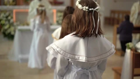 A group of children going to their First Holy Communion Stock Footage 154911842
