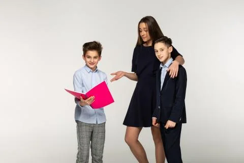 Group of children have fun while doing together homework Stock Photos