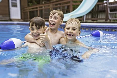 Group of children having fun in Pool on the summer time Stock-Fotos