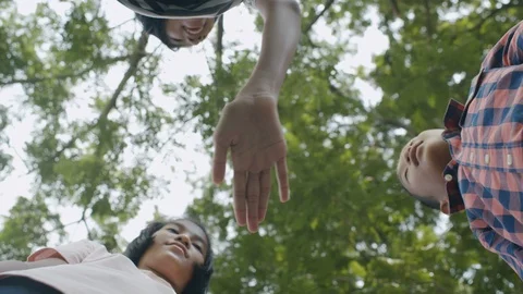 Group of children join hands together to power the team's success. Stock Footage 126373762