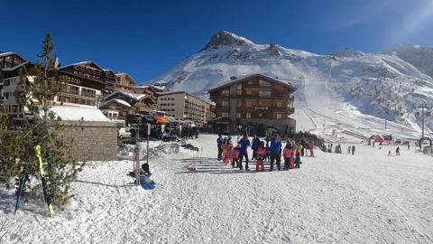 A group of children learn to ski in the Alps Stock Footage 183898545