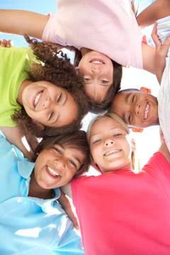 Group Of Children Looking Down Into Camera Stock Photos