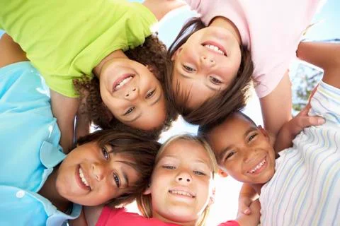 Group Of Children Looking Down Into Camera Stock Photos