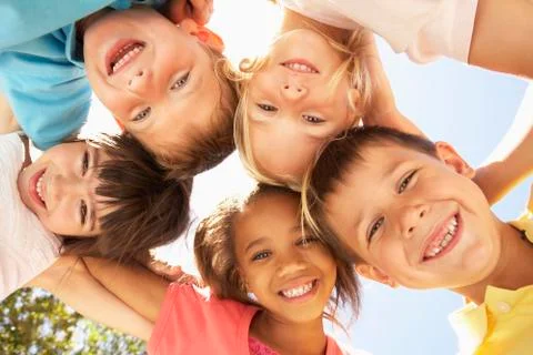 Group Of Children Looking Down Into Camera Stock Photos