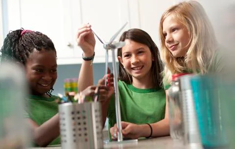 Group of children looking at model windmill Stock Photos