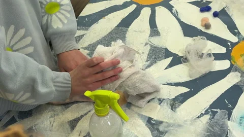 A group of children make a toy from wool, wet felting a blank and squeeze water  Stock-Footage 306536782
