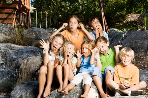 Group of children making funny faces Stock Photos