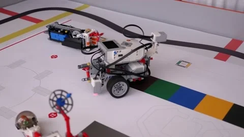 A group of children play with robots in robotics lessons at school. Close up. Stock Footage 142079116