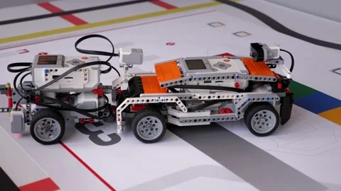 A group of children play with robots in robotics lessons at school. Close up. Stock Footage 142224656