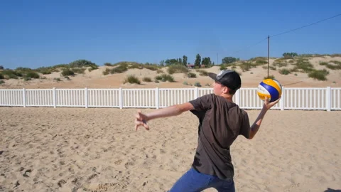 A group of children playing ball on the beach Stock Footage 96419405