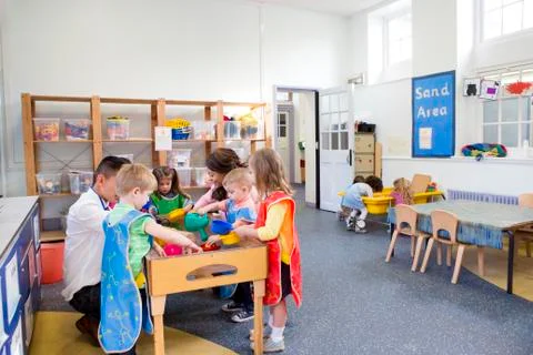 Group of Children Playing in a Classroom Fotos Stock