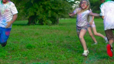 Group of children playing a game of catch in green summer park on a sunny day Stock-Footage 70890668