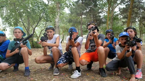 A group of children playing laser tag. children run together. slow mo Stock Footage 96419488