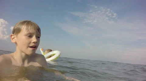 Group of children playing in the sea. Stock Footage 64668983