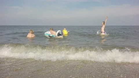Group of children playing in the sea. Stock Footage 65075138