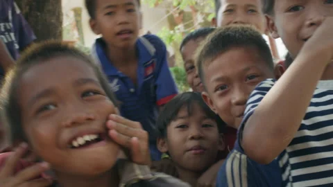 A group of children smiling at the camera in the temple yard,Cambodia, Stock Footage 134370849