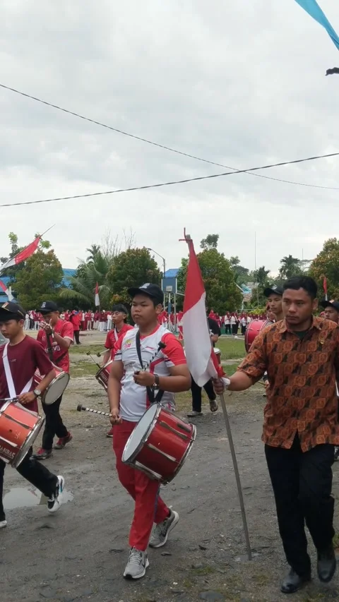 A group of children walking around playing drum band Stock Footage 282416068