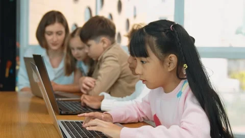 Group of children working or playing laptop, programing system. Erudition. Video stock 274786914