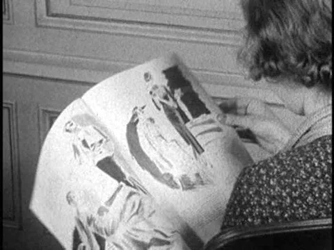 A group chooses fabric and tests it for flammability in the 1930s. Stock Footage 75755951
