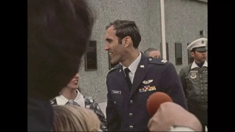 A group of citizens are meet by a returning American soldier at an airport in Stock Footage 111236824