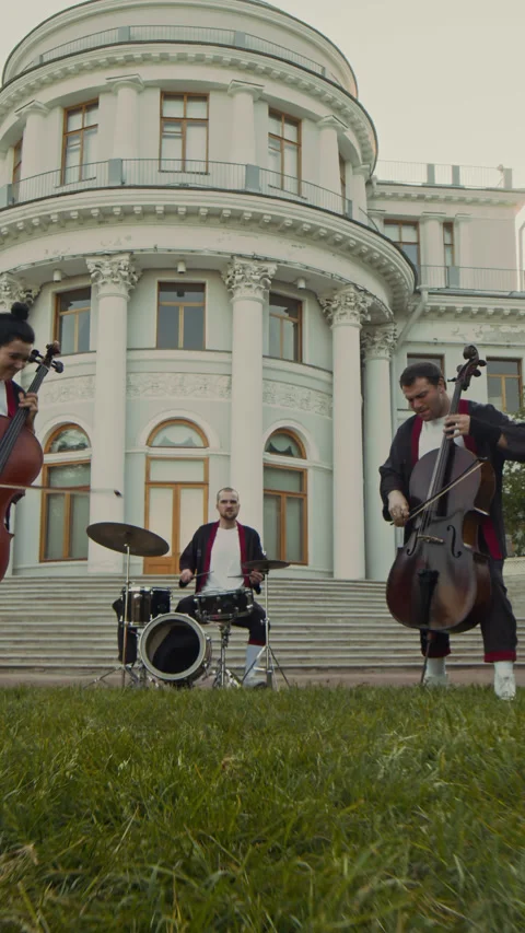 Group of Classical Musicians Playing Together in front of Historical Building Stock Footage 281569261