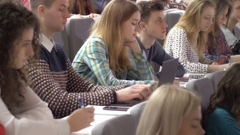 Group of classmates enrolled in a study course in the lecture hall Stock Footage 69909767
