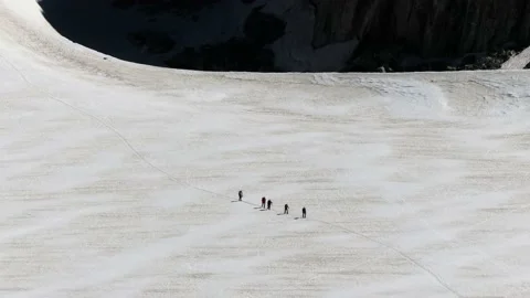 A group of climbers cross the glacier  Stock Footage 137394094