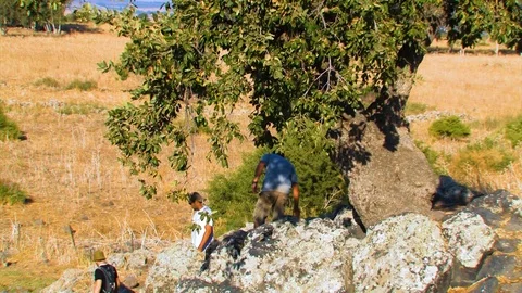 Group climbing down hill Stock Footage 89480104