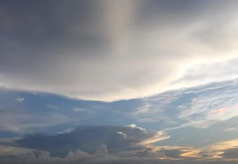 Group cloud top and bottom with sunlight from right. Stock Photos