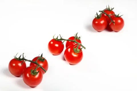 Group cluster cherry tomatoes on white Stock Photos