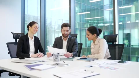 Group of co-workers discussing financial issues at meeting in office. Business  Stock Footage 322222353