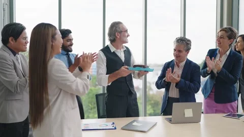 Group of colleague making surprise giving birthday cake to manager while meeting Stock Footage 249241771