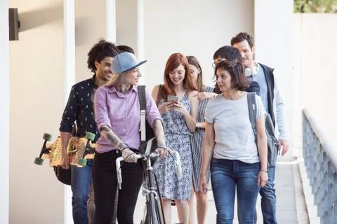 Group of colleagues leaving work together Stock Photos