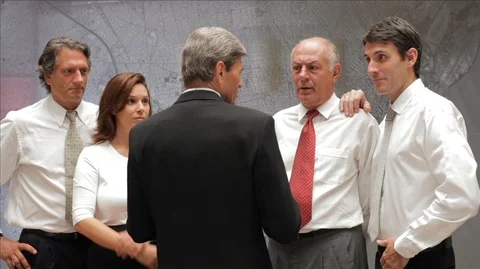 Group of colleagues standing discussing work. Stock Footage 88343017