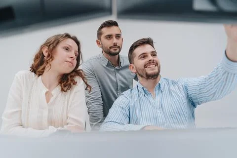 Group of colleagues trying to solve a problem on a computer Stock Photos