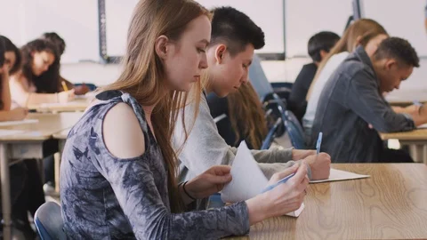 Group Of College Students At Desk In Classroom Taking Test Stock Footage 111921963
