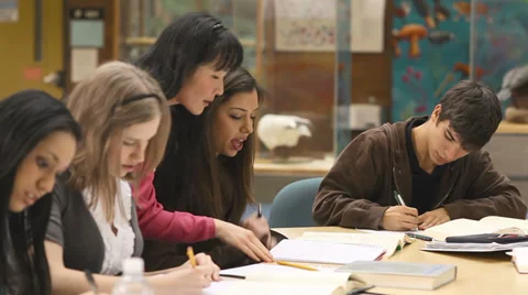 A group of college students study their books and notes in class Stock Footage 33877940