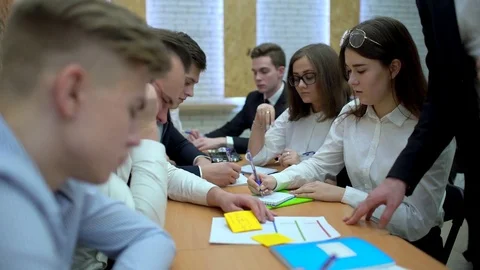 A group of college students study their notes in class, 4 k Stock Footage 85041925