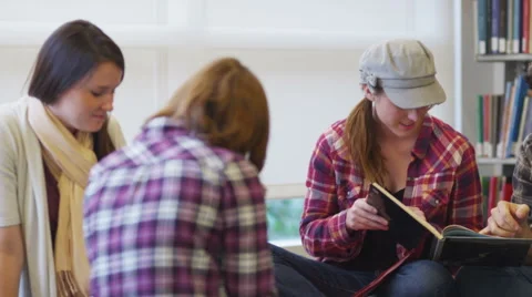 Group of college students studying in library Stock Footage 61676660