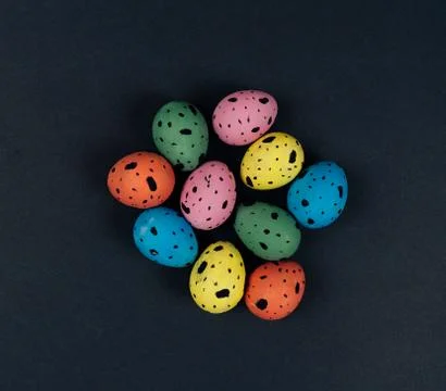 Group of colorful painted Easter quail eggs isolated on black background. Easter Stock Photos