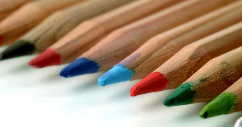 Group of colour pencils rolling off screen Stock Footage 113142707