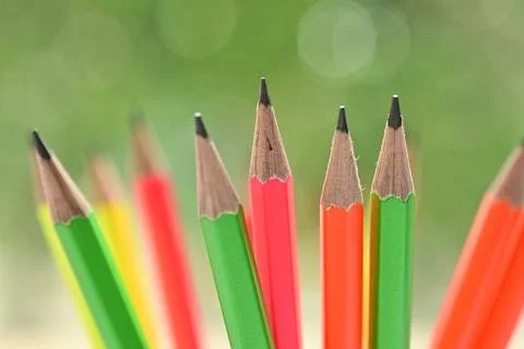 Group of colourful sharp pencil on blur green nature background with bokeh Stock Photos