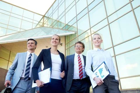 Group of confident associates posing before camera outdoors Stock Photos