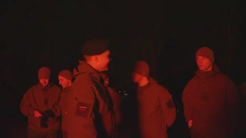 Group of conscripted soldiers in firelight at Lithuanian Independence Stock Footage 253763733