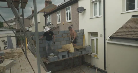 Group of constrcution workers working on a building site Stock Footage 246379171