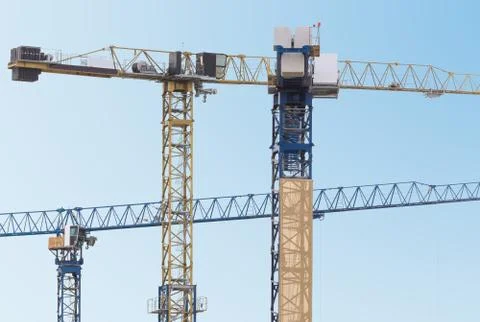 Group of construction cranes Stock Photos